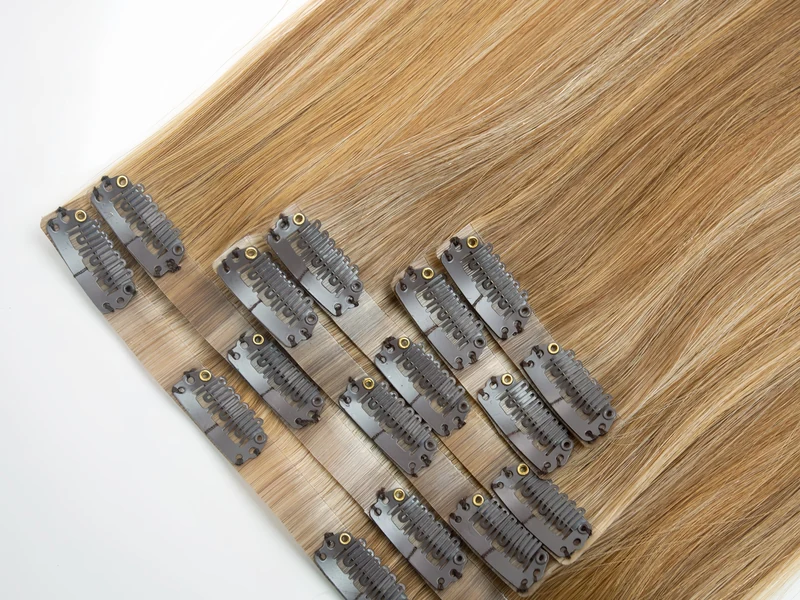 Epoche clip-in human hair extensions showing discreet clips and smooth hair texture