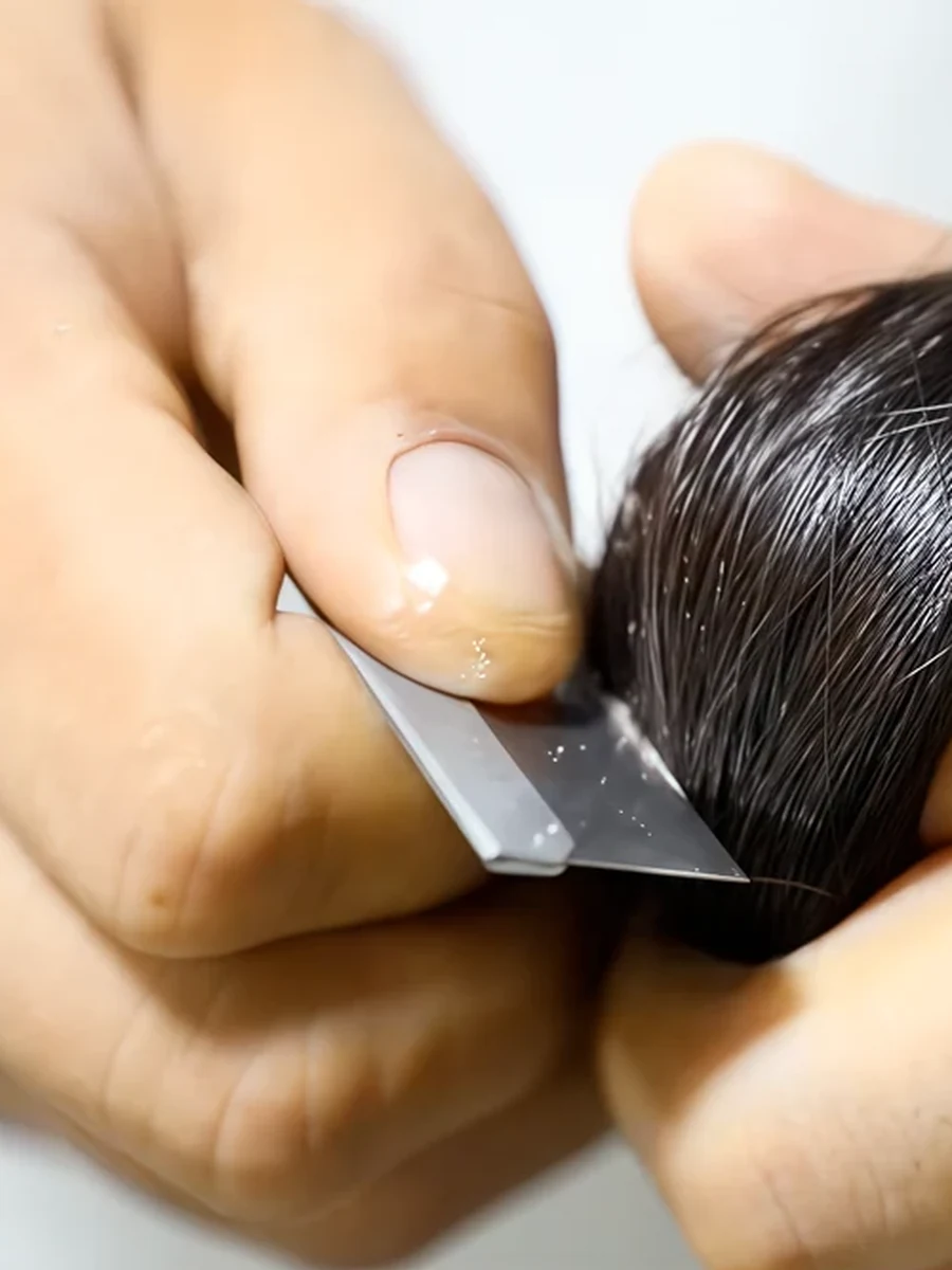 Epoche specialist checking raw human hair cuticle direction and surface condition