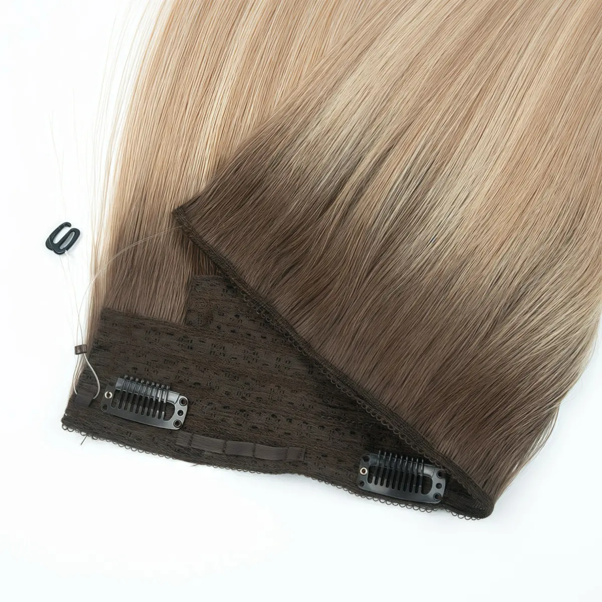 Halo Hair Extensions - Layered Band and Clip Detail Overlapping blonde and rooted halo hair extensions showing the lace bands, stitched edges, snap clips and transparent support wires.