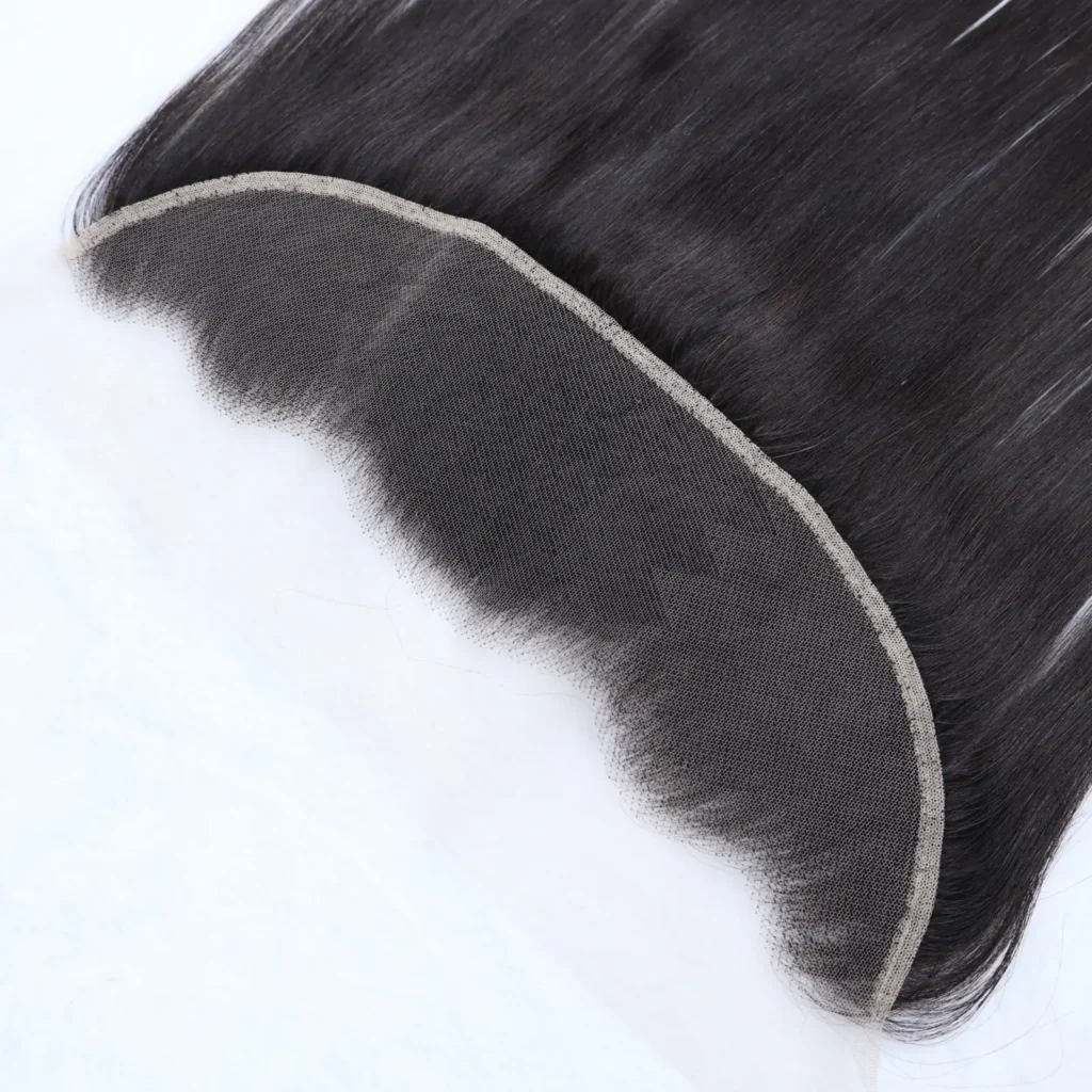 Black hair lace closure laid flat to show the curved mesh base, stitched border and hairline knots.