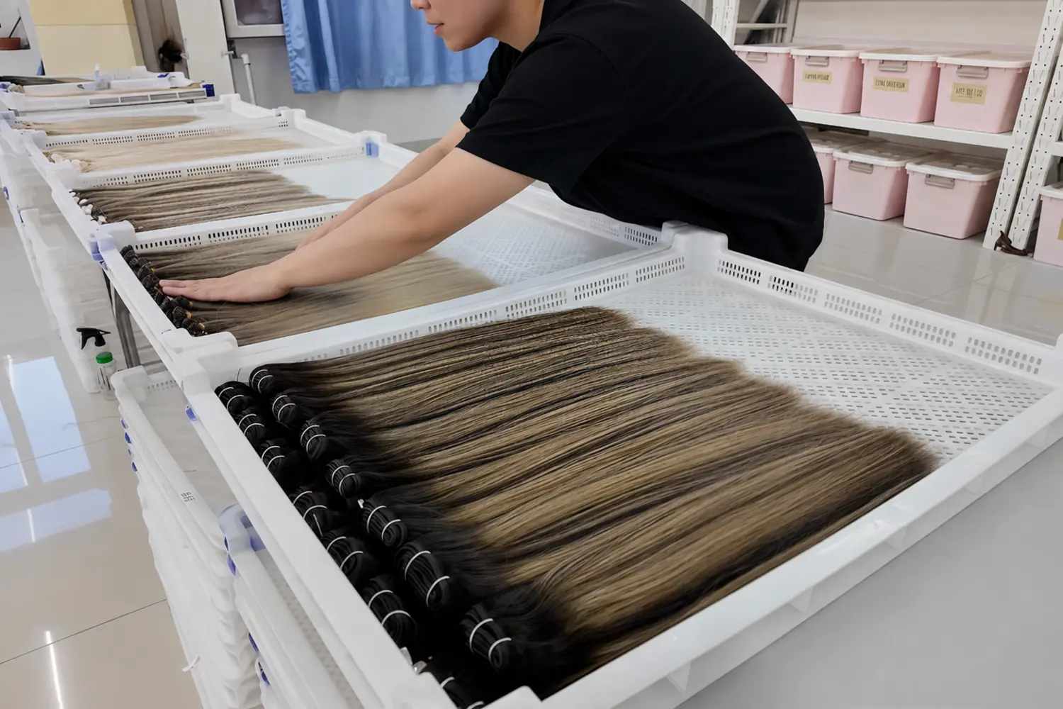 Finished human hair extensions arranged in trays before packing at Epoche Hair