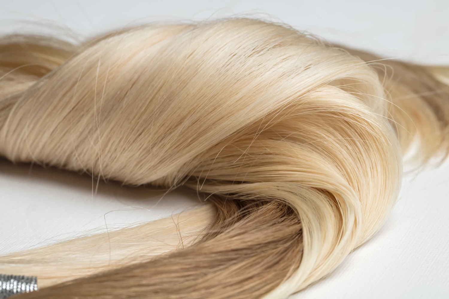 Blonde and brown human hair extension samples showing color and texture detail