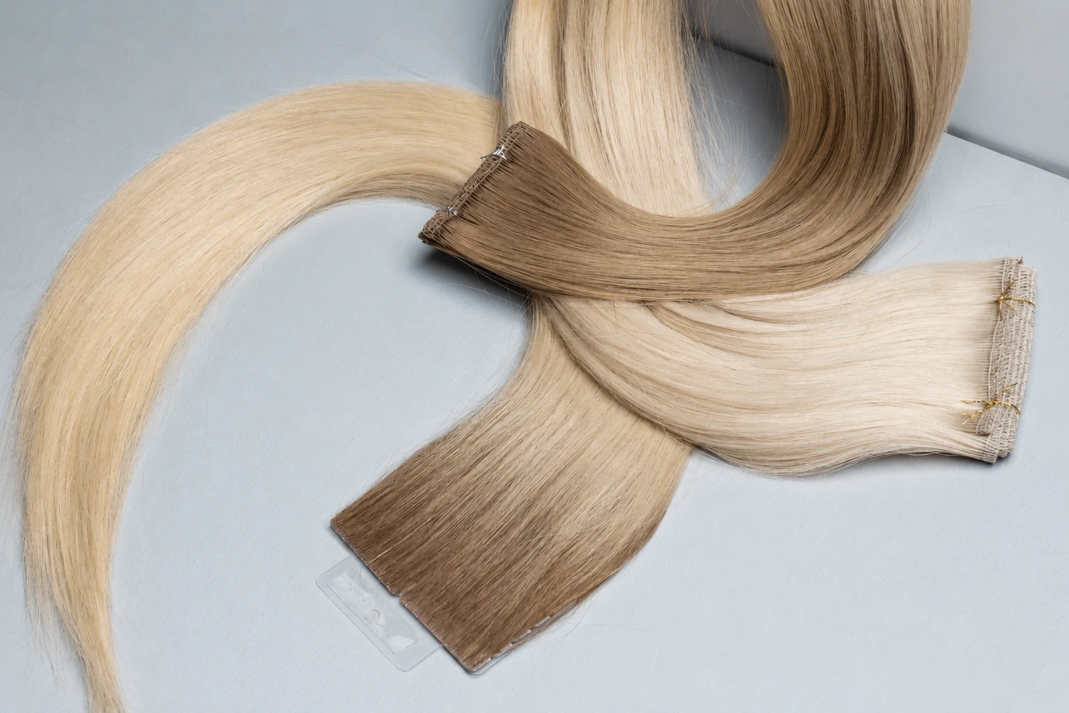 Different hair extension weft constructions and color options for custom manufacturing