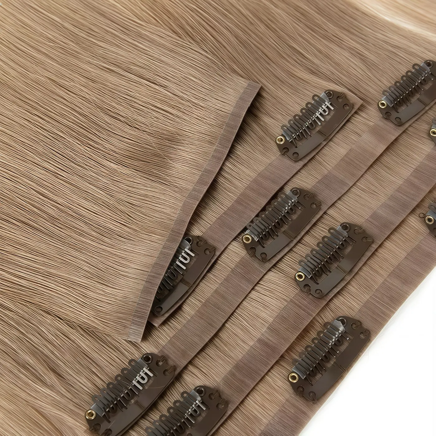 PU clip-in hair extensions showing flexible bases and attached snap clips
